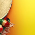 Cinco de Mayo Sombrero and Maracas On Yellow Background